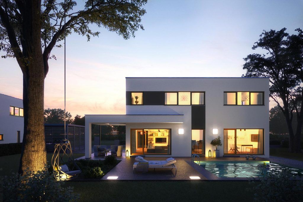 Akzento 155 ist ein Architektenhaus, das zeitgemäßes Wohnen auf zwei Ebenen ermöglicht. Dabei überzeugt es mit seiner Außenansicht nicht nur bei Nacht. Das moderne Fertighaus folgt klaren Linien und besteht aus zurückhaltenden Materialien, die ein harmonisches Gesamtbild schaffen.